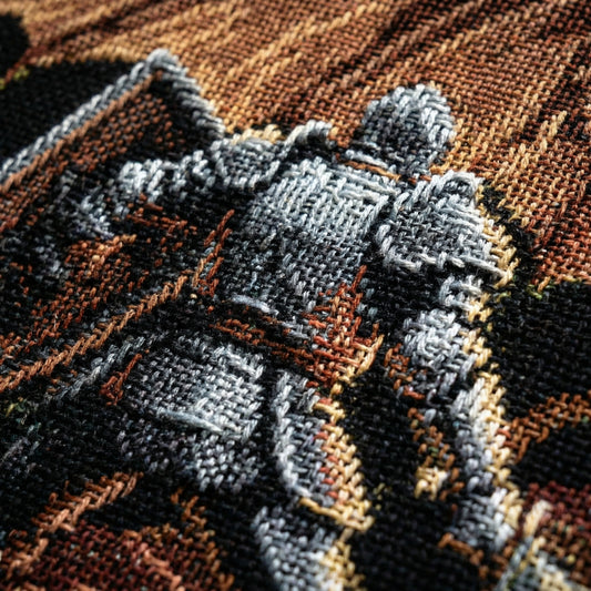Extreme close-up of woven cotton blanket showing dragon fantasy pixel art with visible yarn texture and weave detail