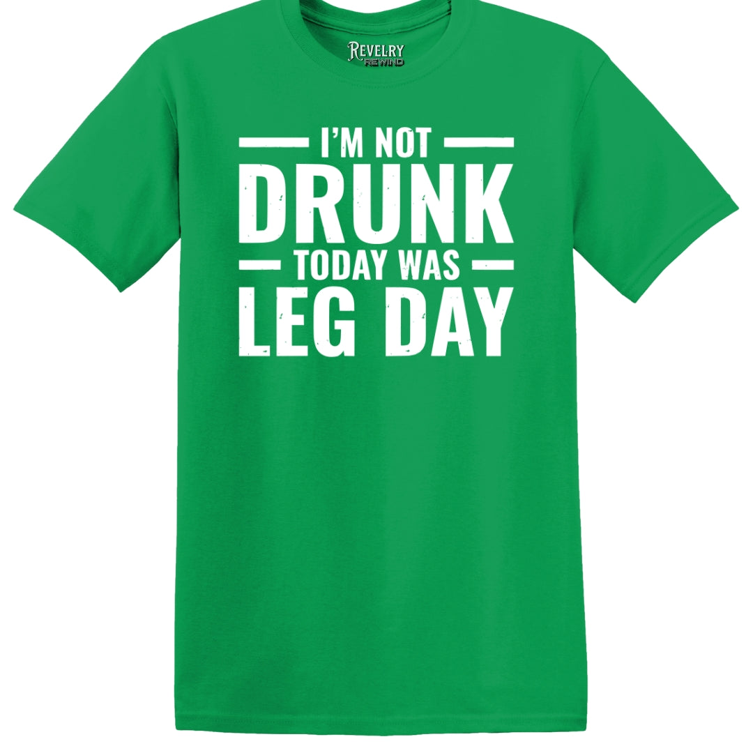 Flat lay of Leg Day Drunk design on green t-shirt