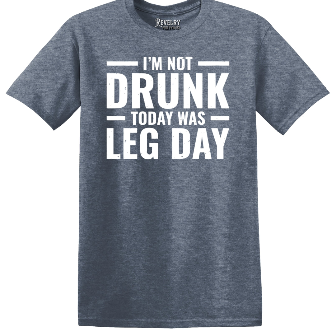 Flat lay of Leg Day Drunk design on heather indigo t-shirt