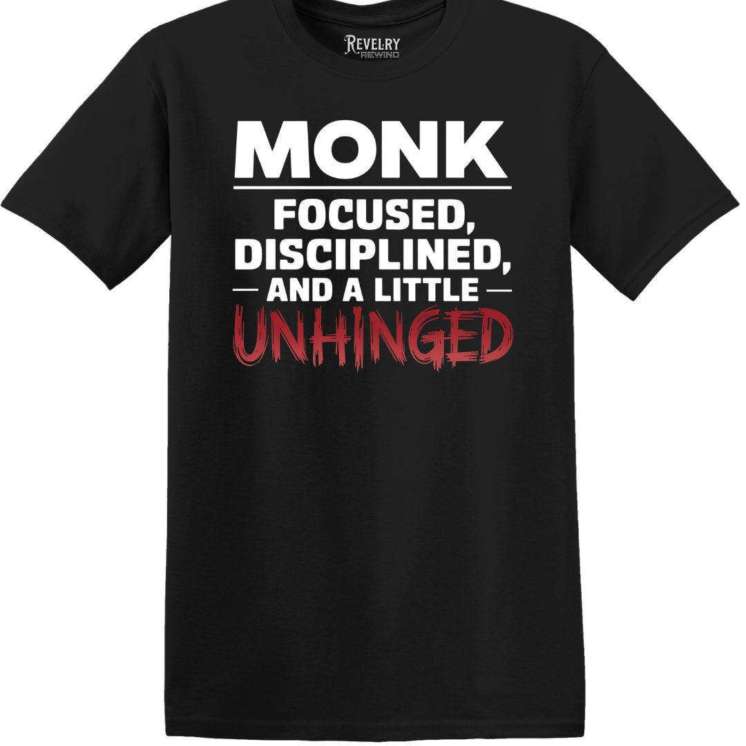 Black flatlay of "Monk Mode: Unhinged" t-shirt with bold white and red text
