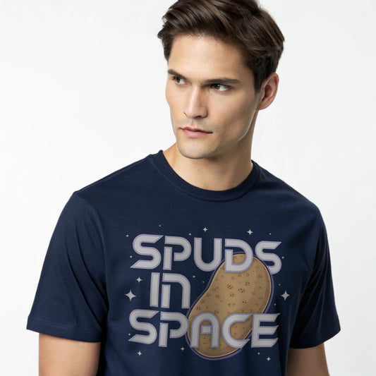 Male model wearing a navy crew-neck t-shirt with “Spuds in Space” graphic, studio shot on a white drape backdrop.