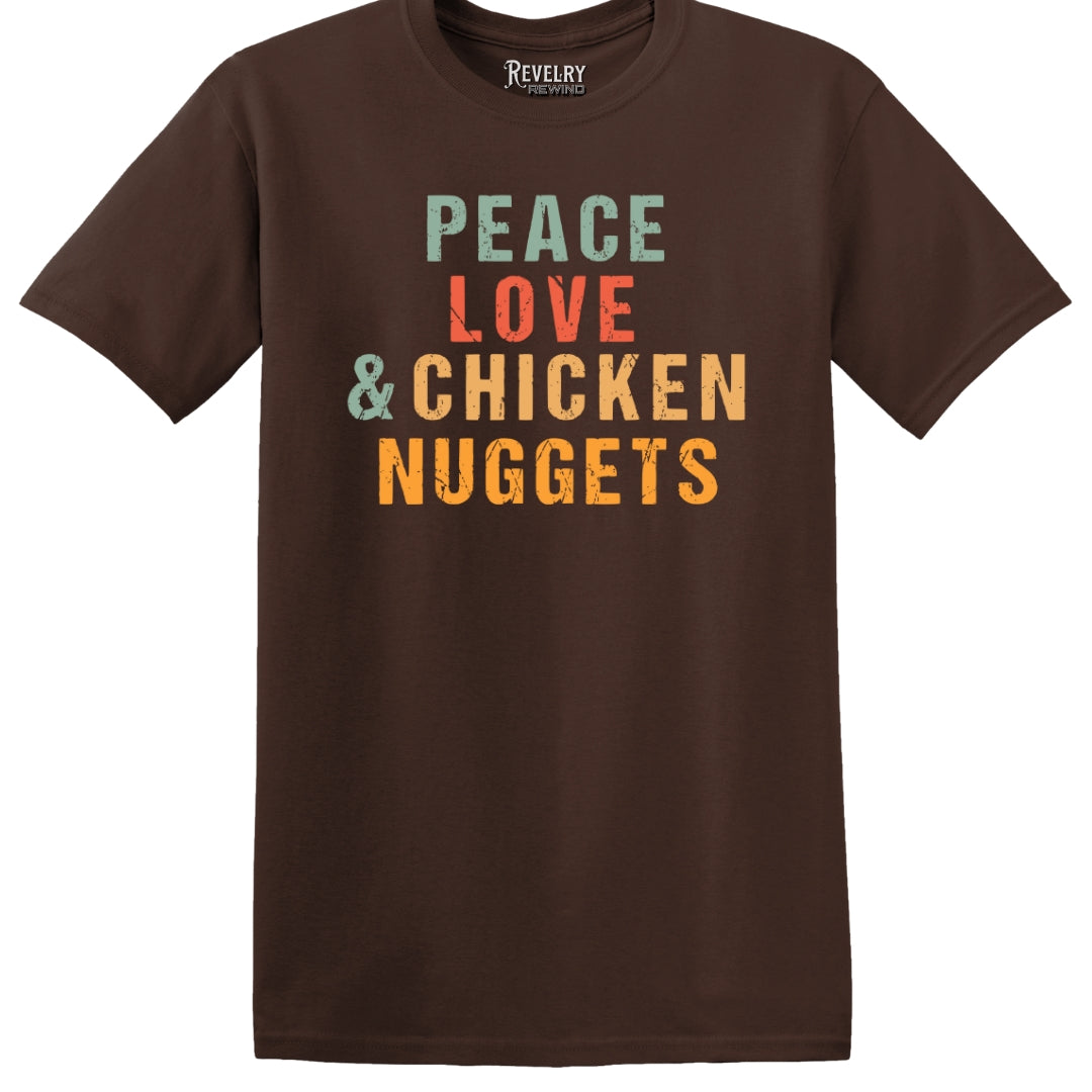 Flat lay of Peace Love & Chicken Nuggets design on dark chocolate t-shirt