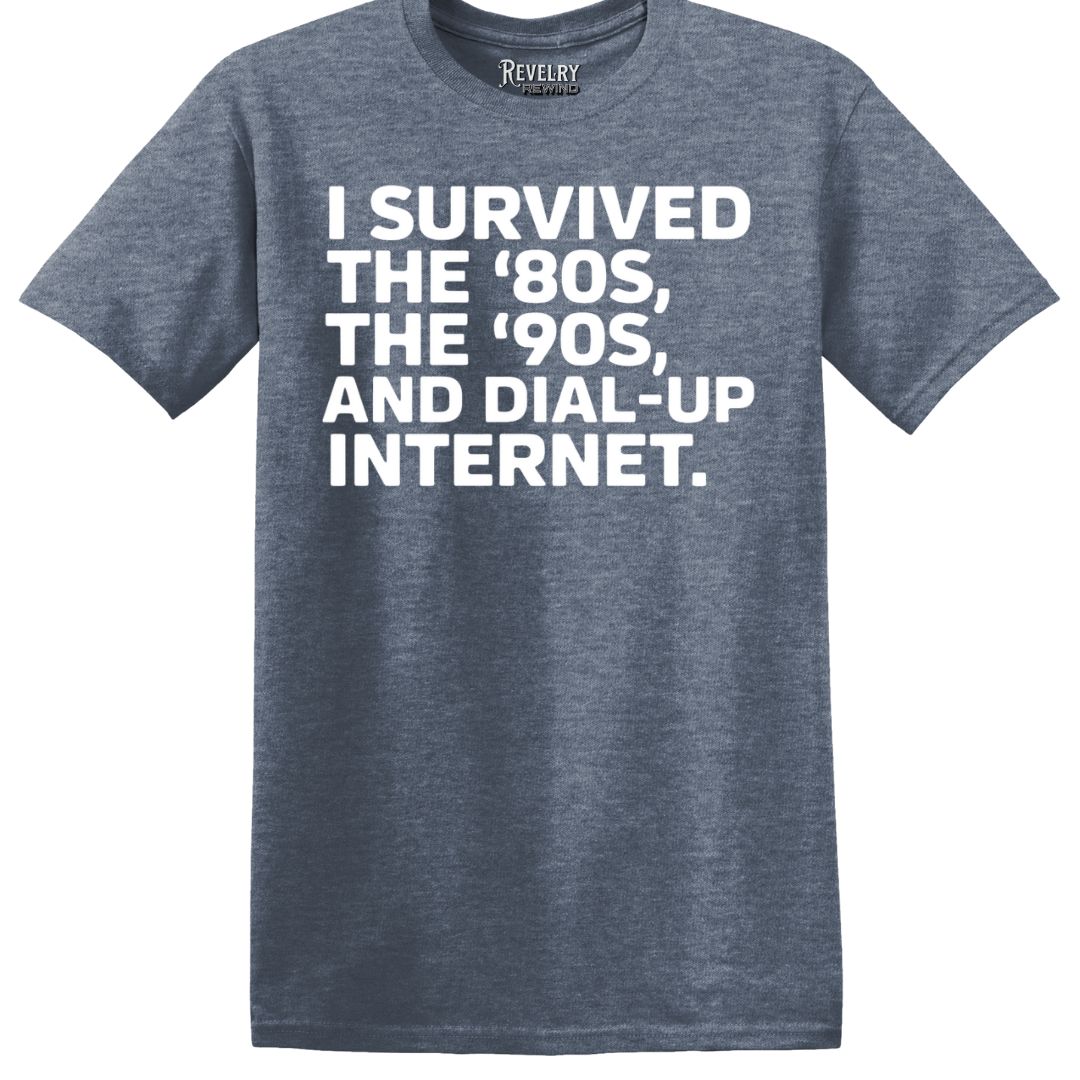 Flat lay of heather indigo t-shirt that says “I Survived the ‘80s, ‘90s…”