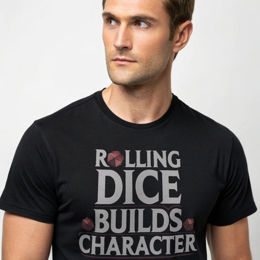Black studio mockup of Rolling Dice Builds Character tee on a male model, front view, natural eyes, plain crew neck