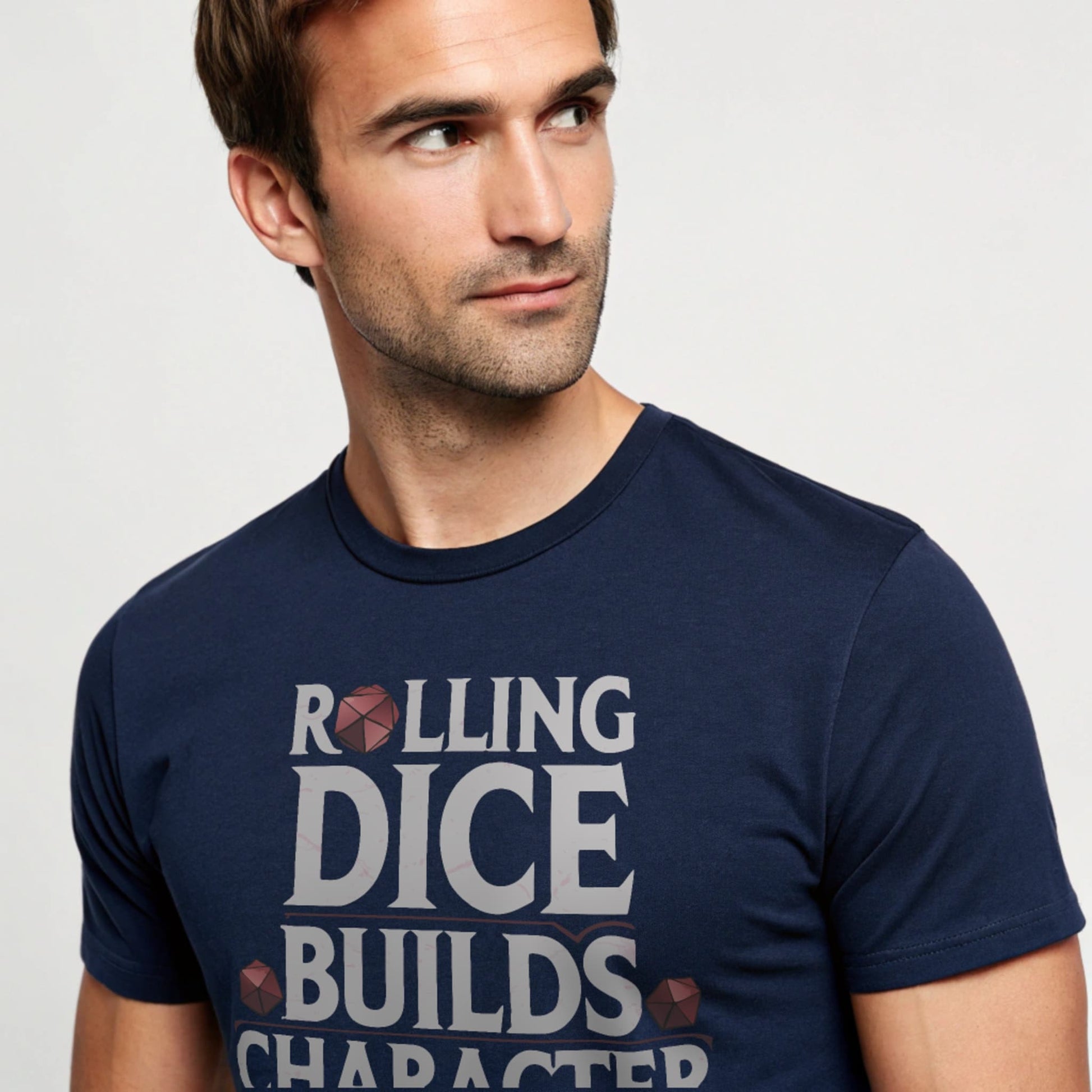 Navy studio mockup of Rolling Dice Builds Character tee on a male model, front view, natural eyes, plain crew neck