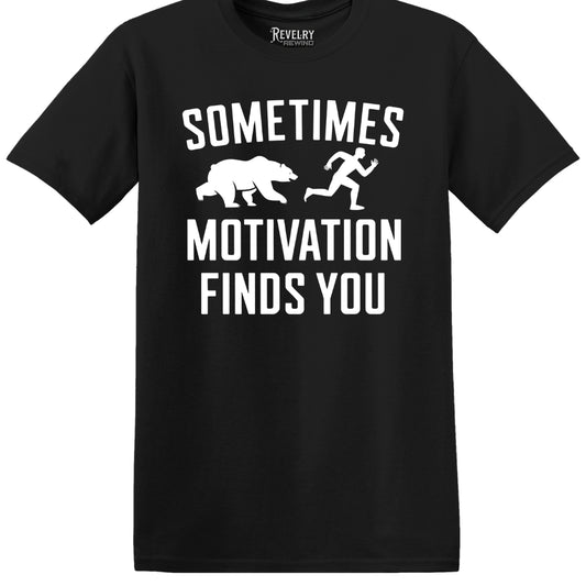 Flat lay of Sometimes Motivation Finds You design on black t-shirt