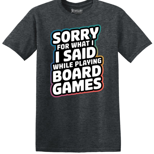 Flat lay of Sorry for What I Said While Playing Board Games design on dark heather t-shirt