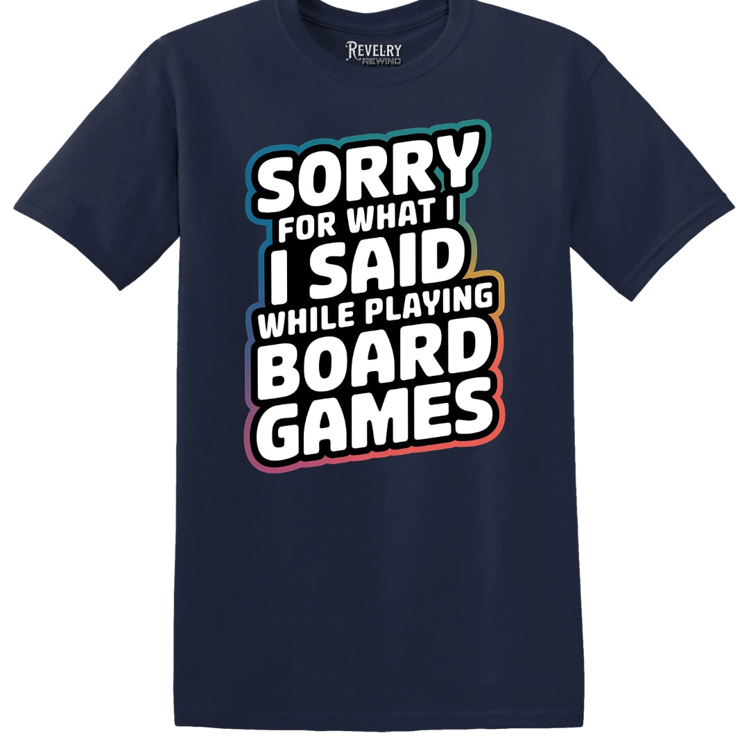 Flat lay of Sorry for What I Said While Playing Board Games design on navy t-shirt