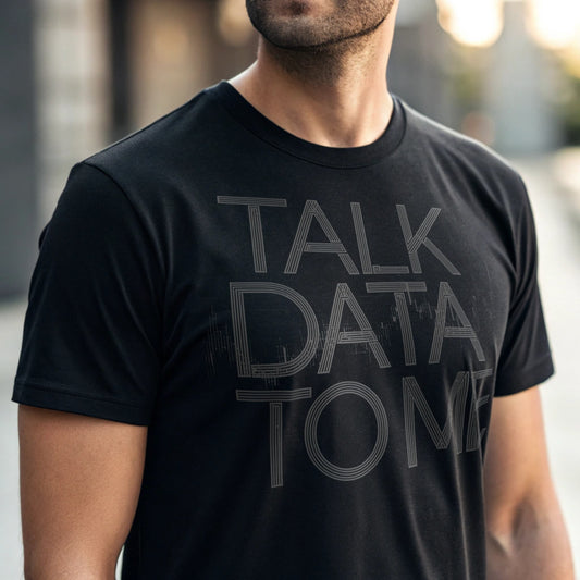 Close-up of man wearing black “Talk Data to Me” T-shirt outside