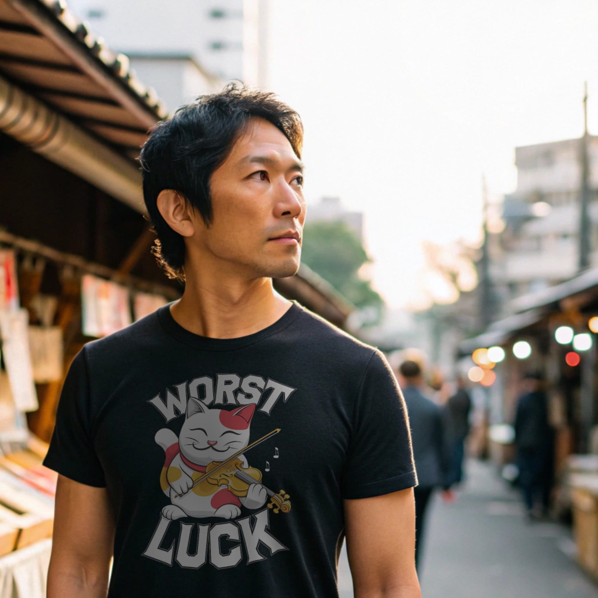 Black lifestyle mockup of Worst Luck T-Shirt on a male model browsing a busy street market stall selling shrine charms and omikuji