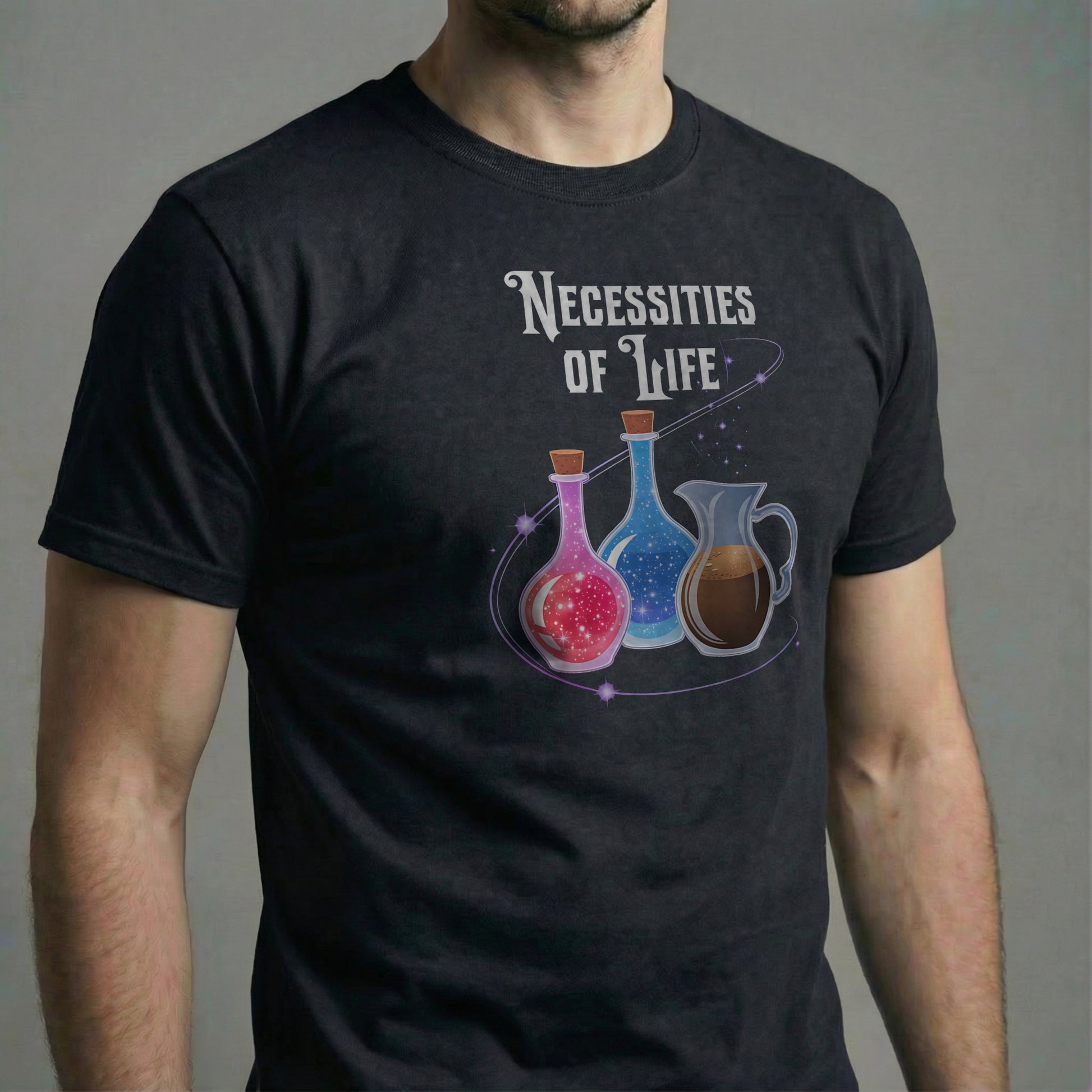 Man wearing a black Necessities of Life T-shirt in a studio close-up