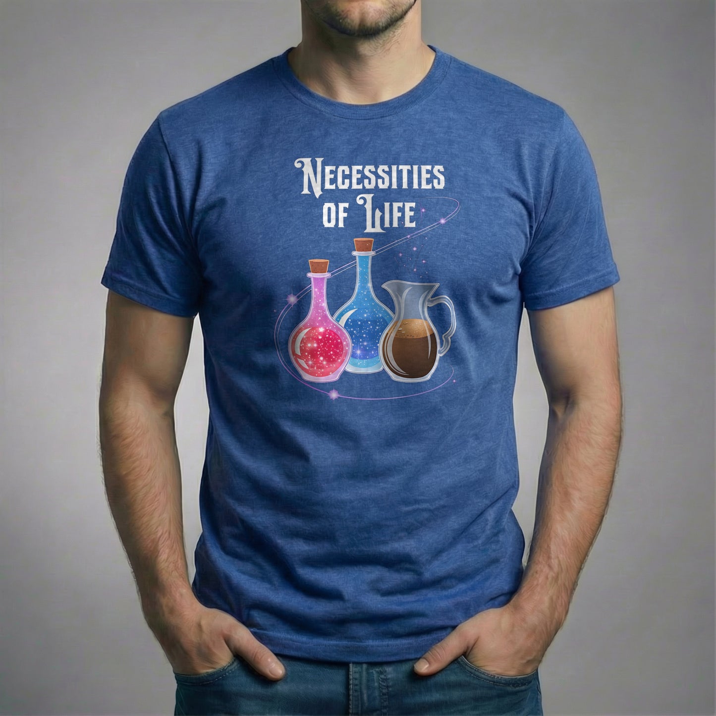 Man wearing a heather royal Necessities of Life T-shirt standing with hands in pockets