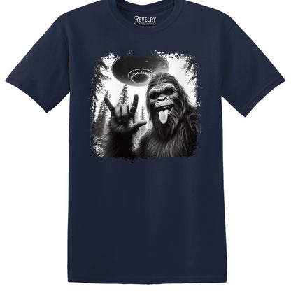 Flat lay of Bigfoot UFO Rocker design on navy t-shirt