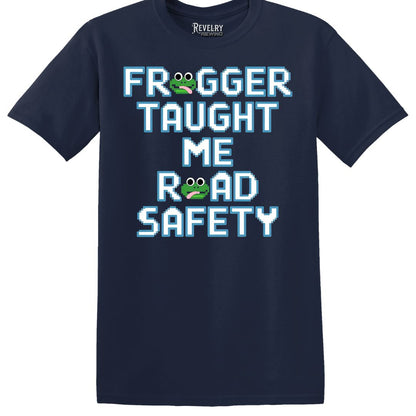 Flat lay of Frogger Taught Me Road Safety design on navy blue t-shirt