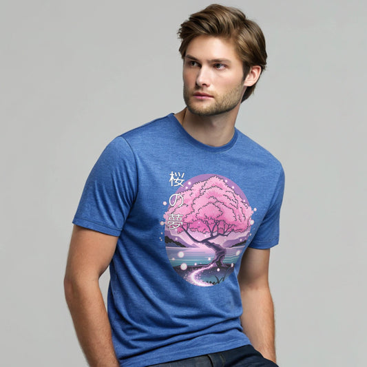 Male model wearing a heather royal crew-neck t-shirt with pink cherry-tree graphic, studio shot by a window-lit backdrop.