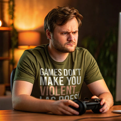 Man in military green gamer shirt holding controller with intense focus, shirt says “Games Don’t Make You Violent… Lag Does”