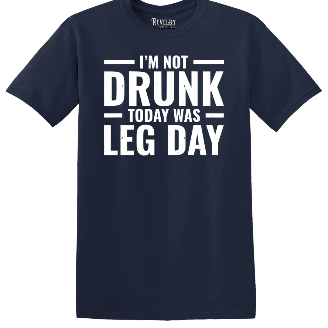 Flat lay of Leg Day Drunk design on navy t-shirt