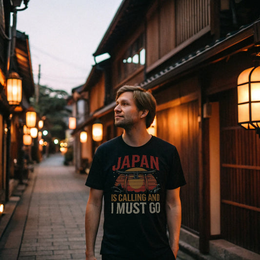 Man in black Japan travel shirt walking through traditional Kyoto alley at dusk