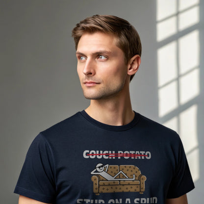 Male model wearing a navy crew-neck t-shirt with “Couch Potato: Stud on a Spud” graphic, studio shot by a window-lit backdrop