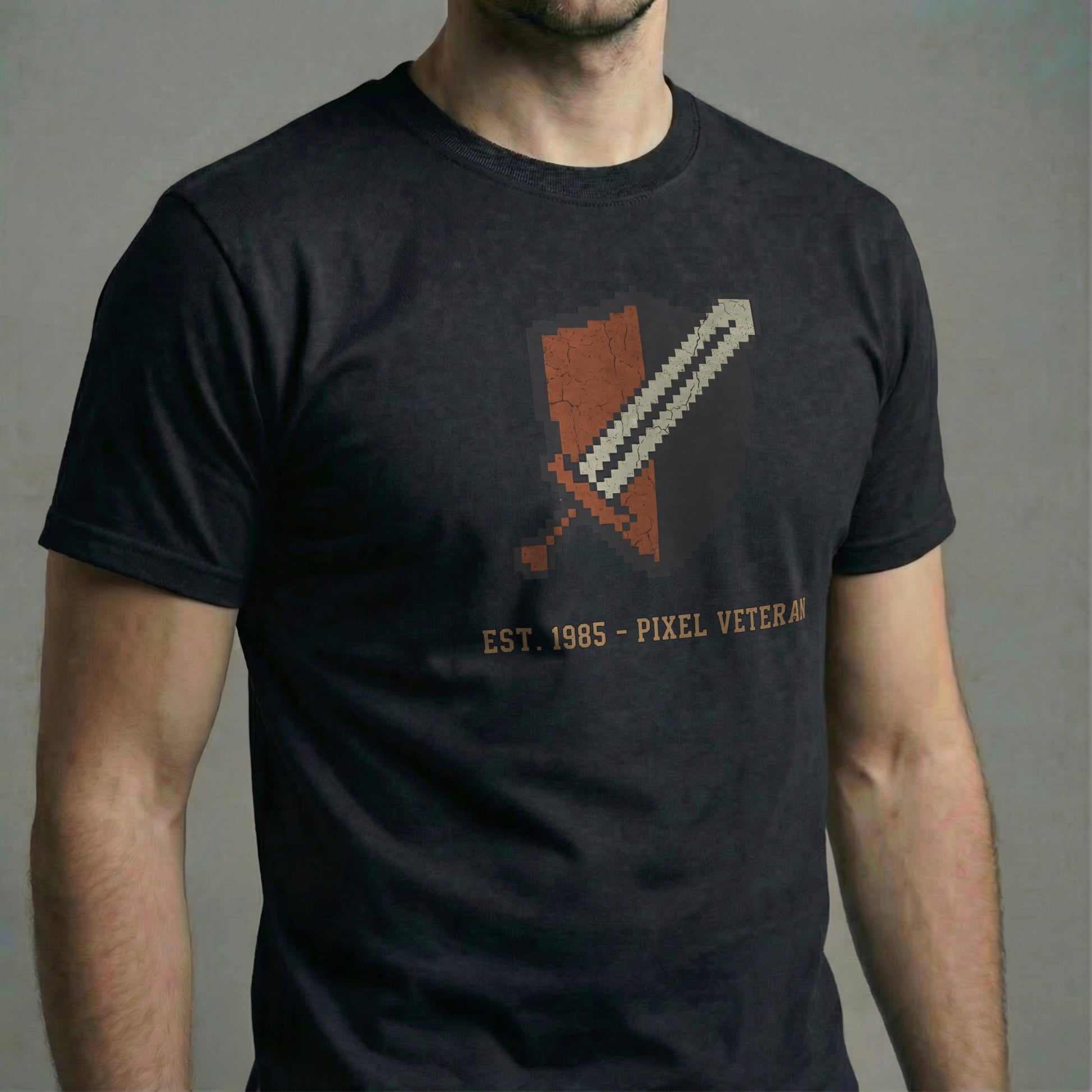 Pixel Veteran T-Shirt in System Black. Close-up of the distressed 8-Bit crest graphic on the model's torso.