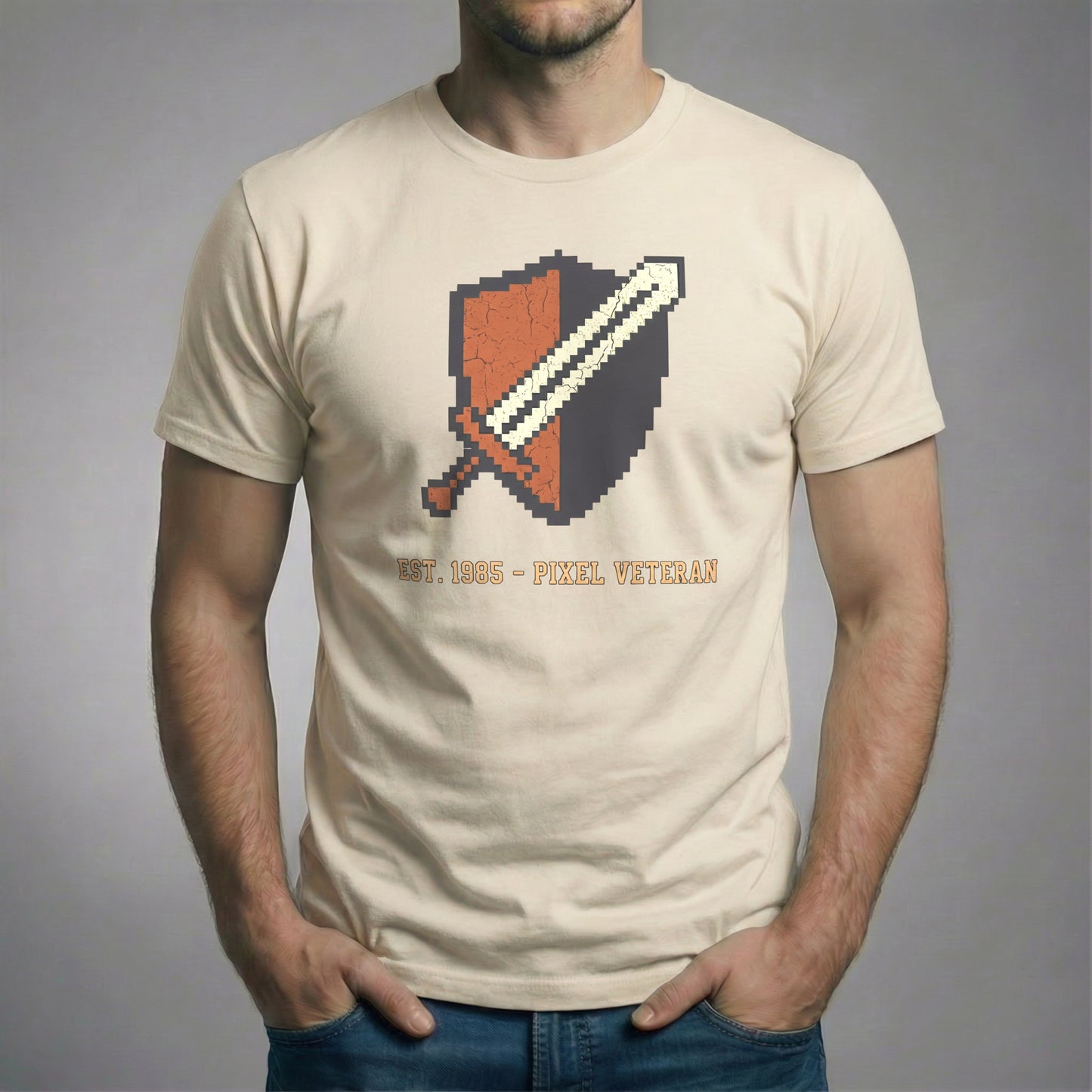 Pixel Veteran T-Shirt in Vintage Cream color, featuring the distressed 8-Bit sword and shield crest.