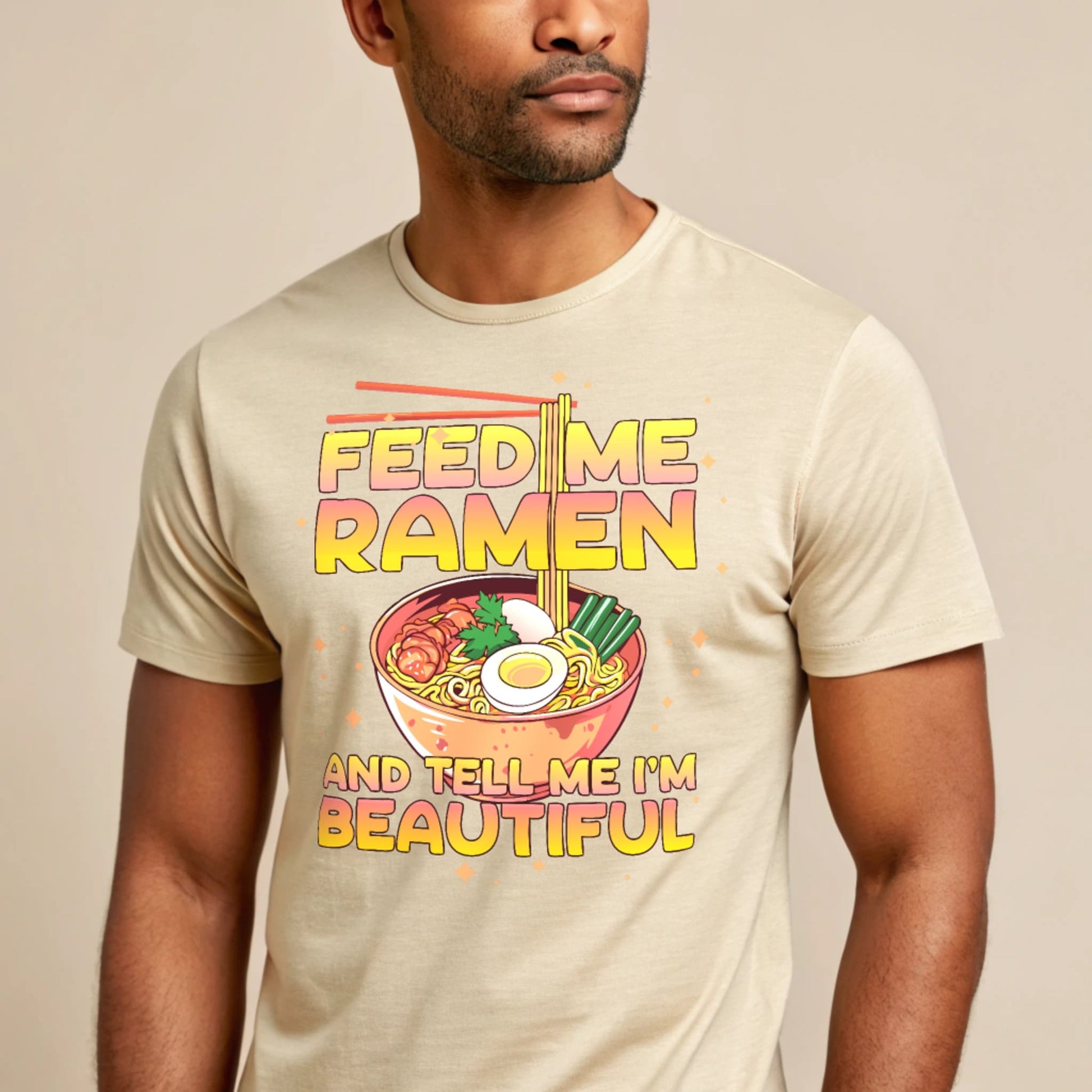 Studio mockup of a male model wearing a natural-colored Ramen Lover T-Shirt against a light beige background.