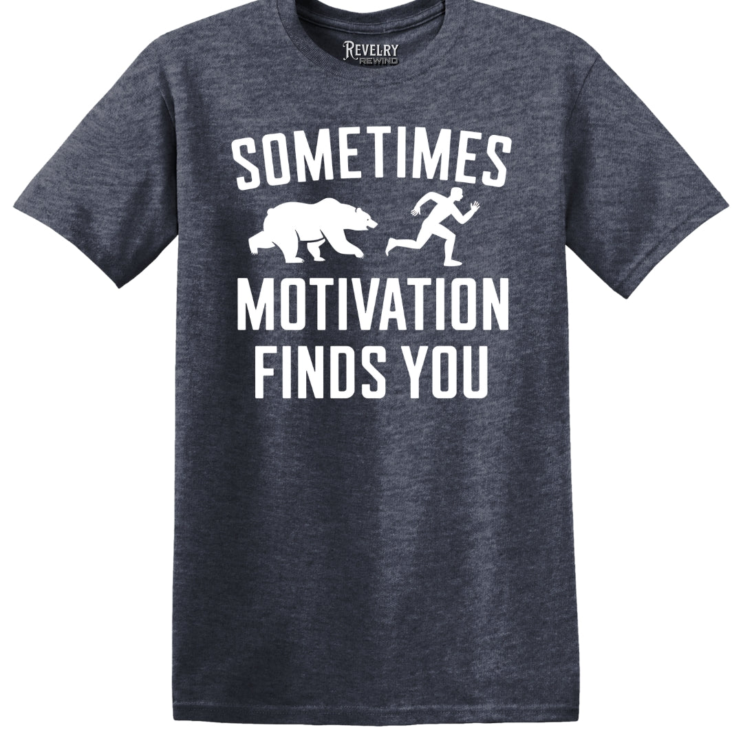 Flat lay of Sometimes Motivation Finds You design on heather navy t-shirt
