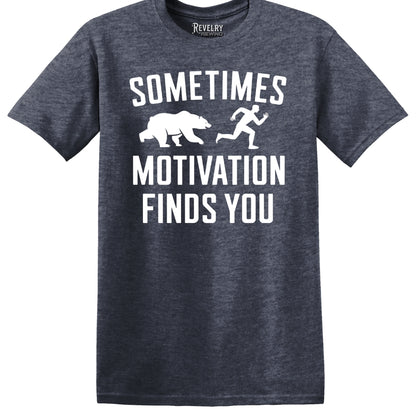 Flat lay of Sometimes Motivation Finds You design on heather navy t-shirt