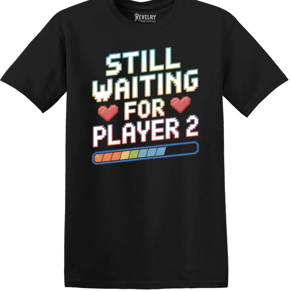 Flat lay of Still Waiting for Player 2 design on black t-shirt