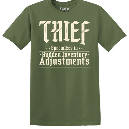 Military green "Thief: Specializes in Sudden Inventory Adjustments" T-Shirt flatlay