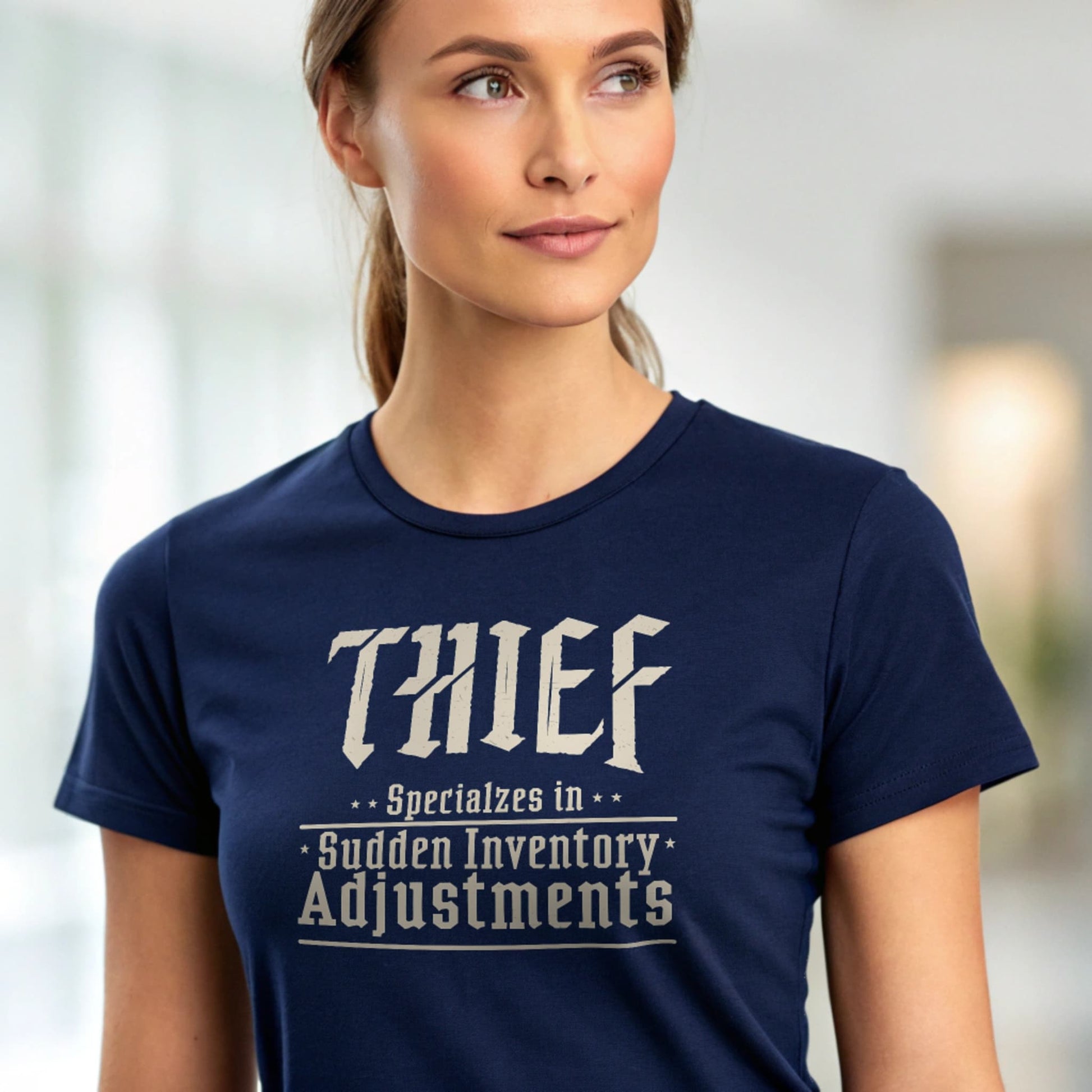 Navy studio mockup of Thief: Sudden Inventory Adjustments T-Shirt on a female model, front view, plain crew neck