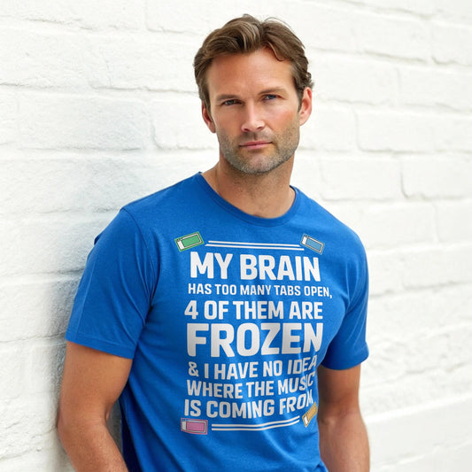 Hyper-realistic mockup of a 25–40-year-old man wearing a royal blue Too Many Tabs T-Shirt standing against a white-brick wall.