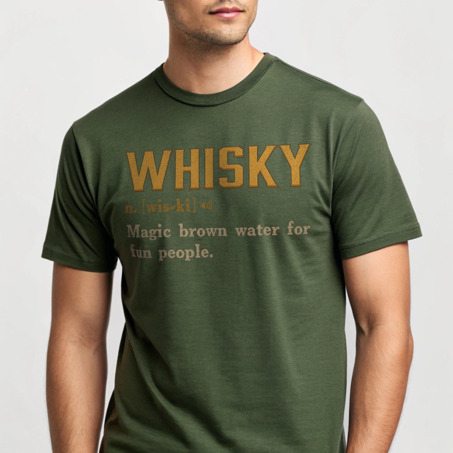 Studio mockup of Whisky Definition T-Shirt in Military Green showing ‘Whisky n. [wis-ki] Magic brown water for fun people’ design.